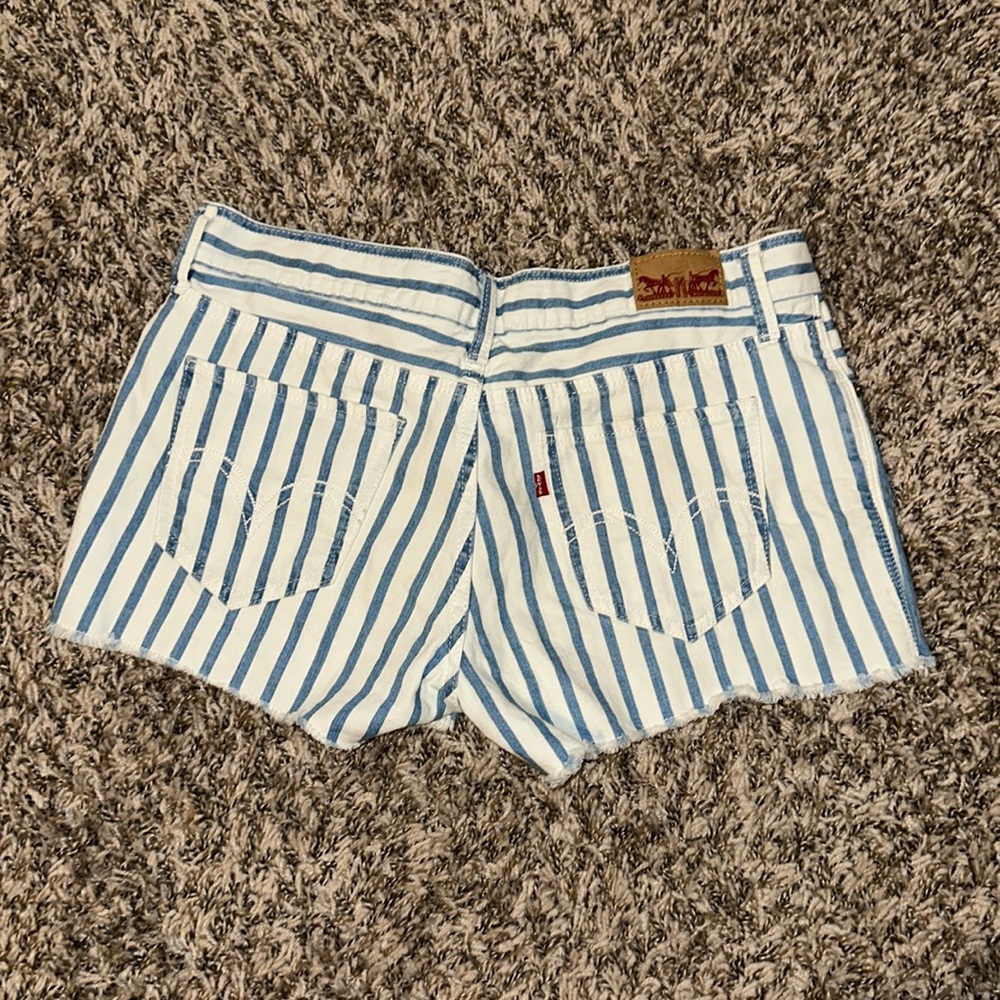 Levi’s blue and white Jean shorts. Size 7 but would fit a size 5-6.